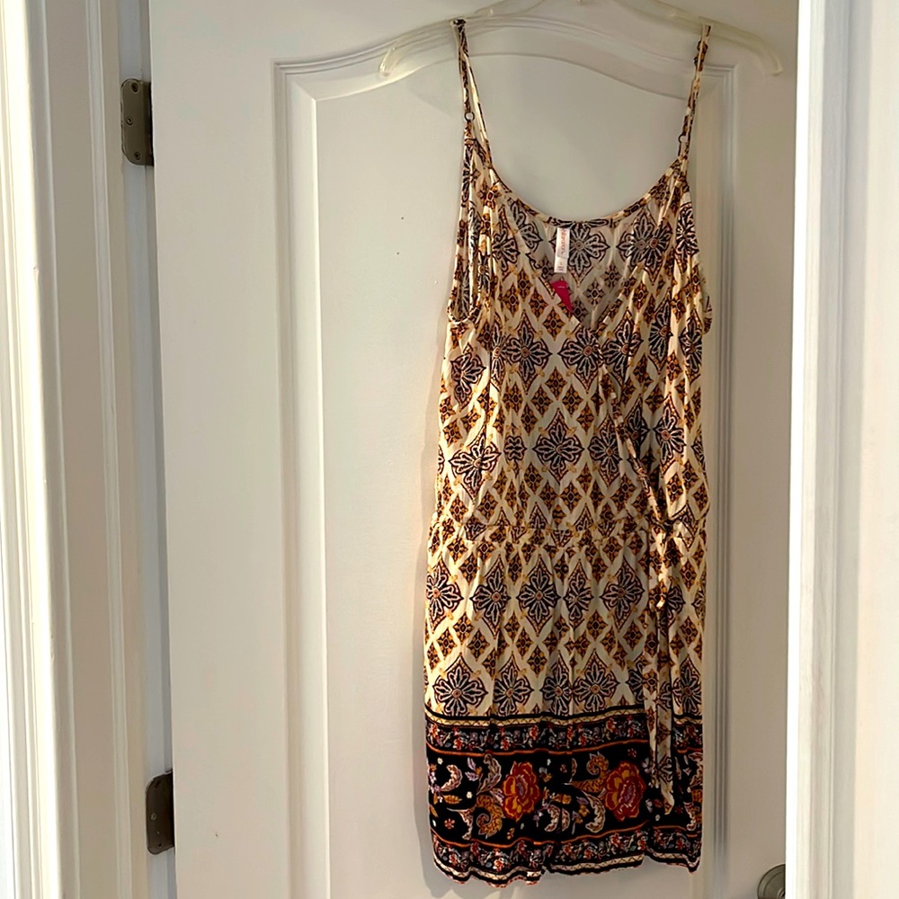 Printed romper with adjustable spaghetti straps.  Never worn.  NWT